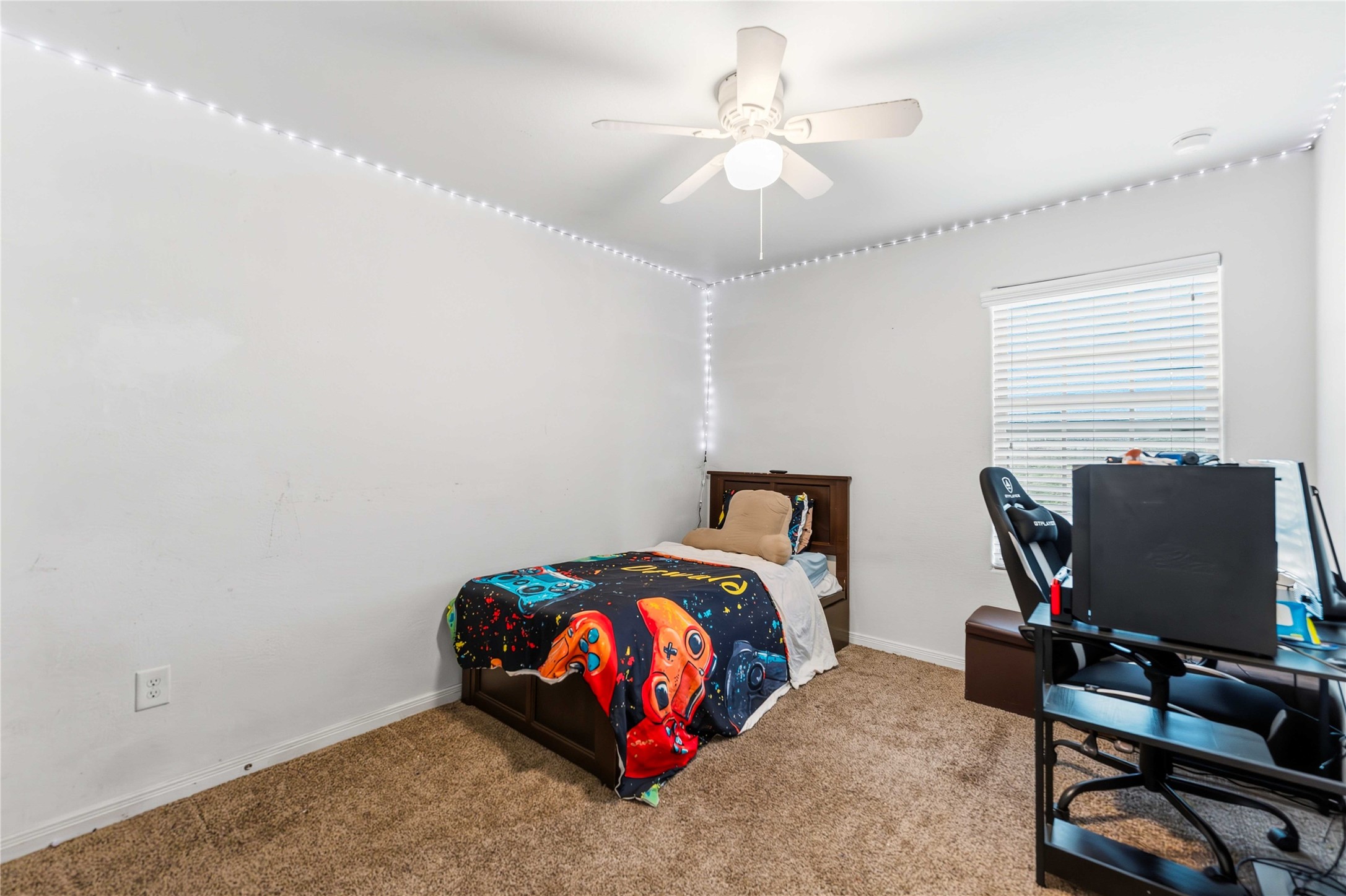 10114 Orchid Spring Lane Houston, TX 77044 - Photo 17 of 22 a bedroom with bed and a window