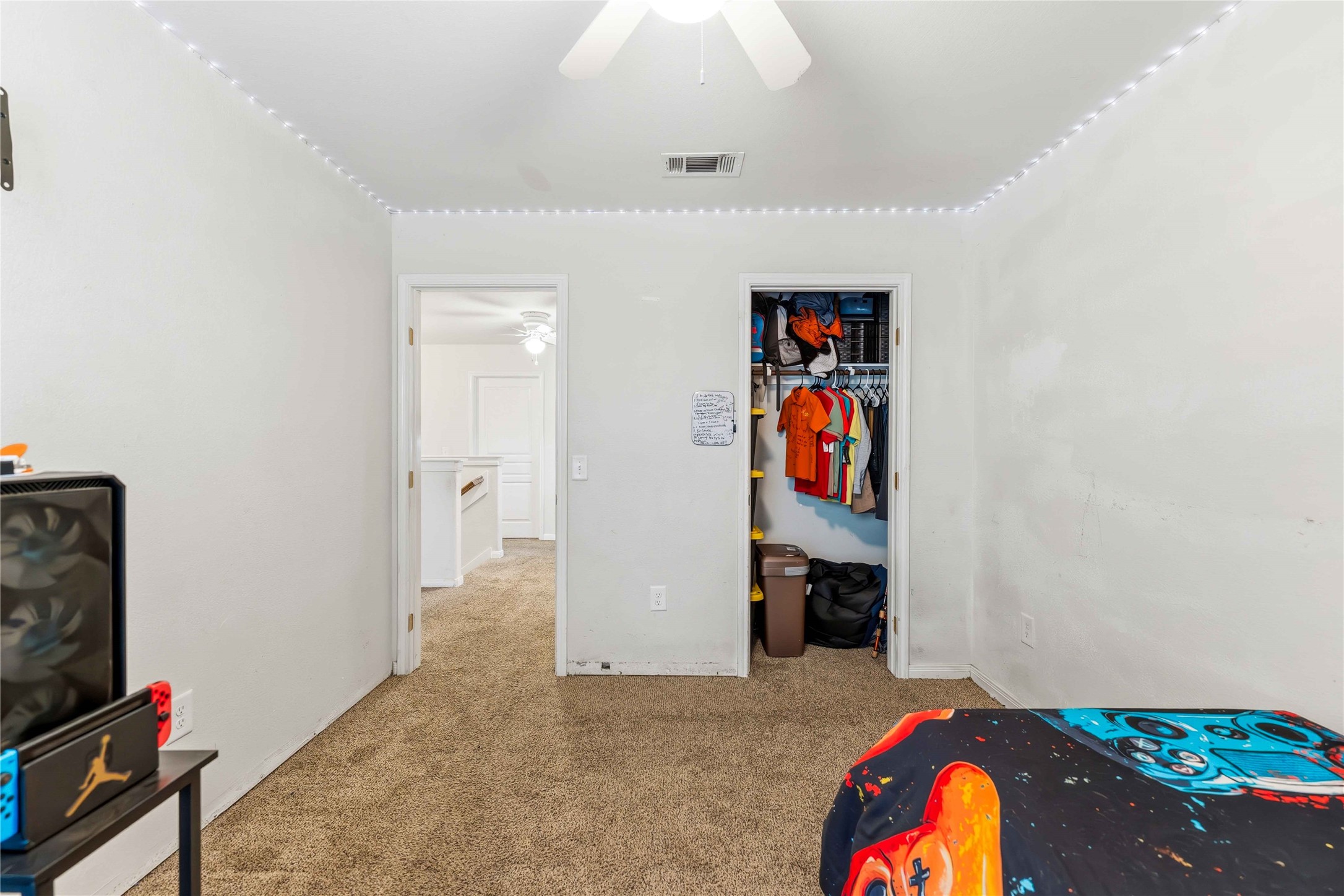 10114 Orchid Spring Lane Houston, TX 77044 - Photo 18 of 22 a bedroom with a bed and furniture