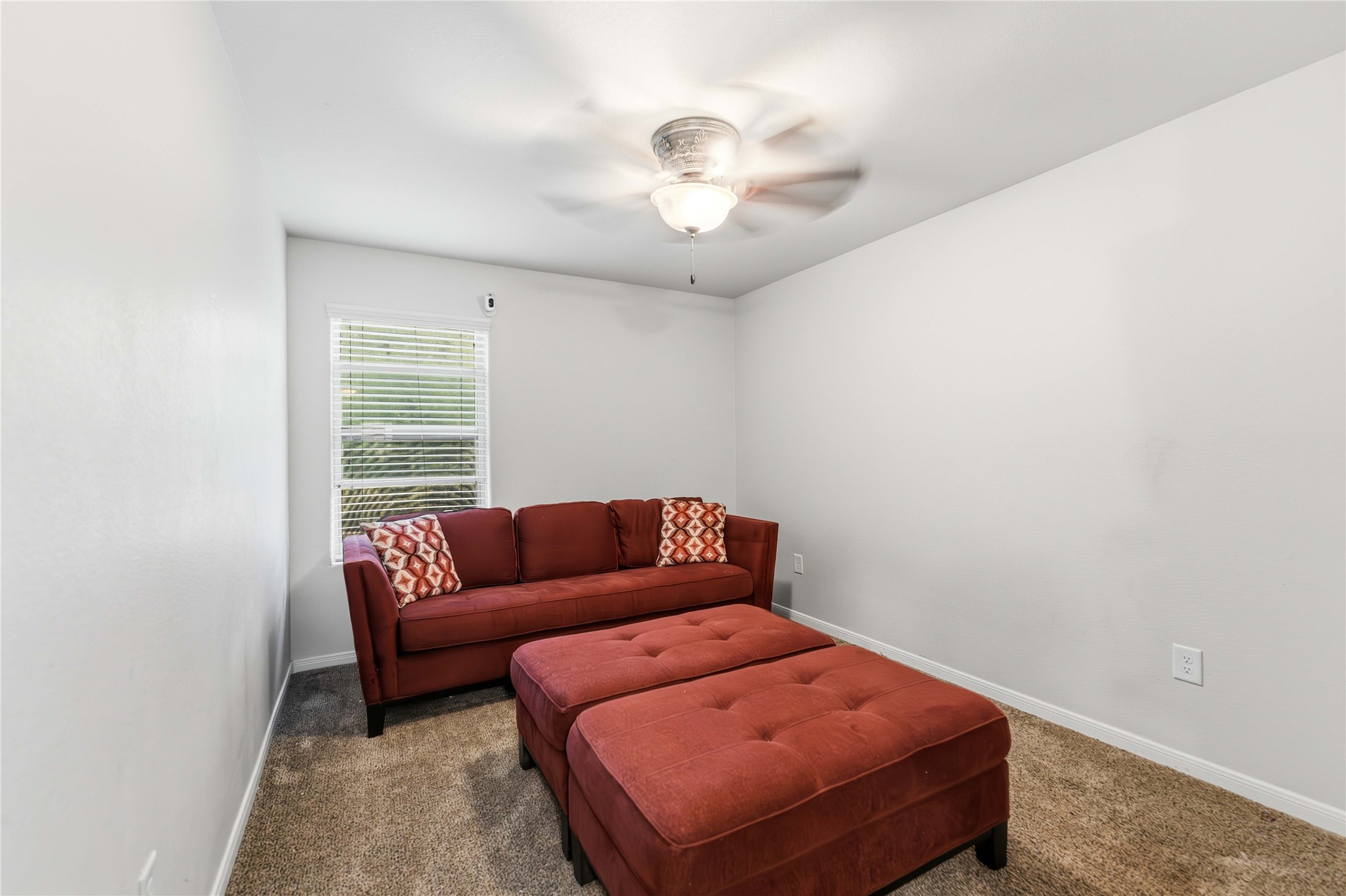 10114 Orchid Spring Lane Houston, TX 77044 - Photo 19 of 22 a living room with furniture and a chandelier