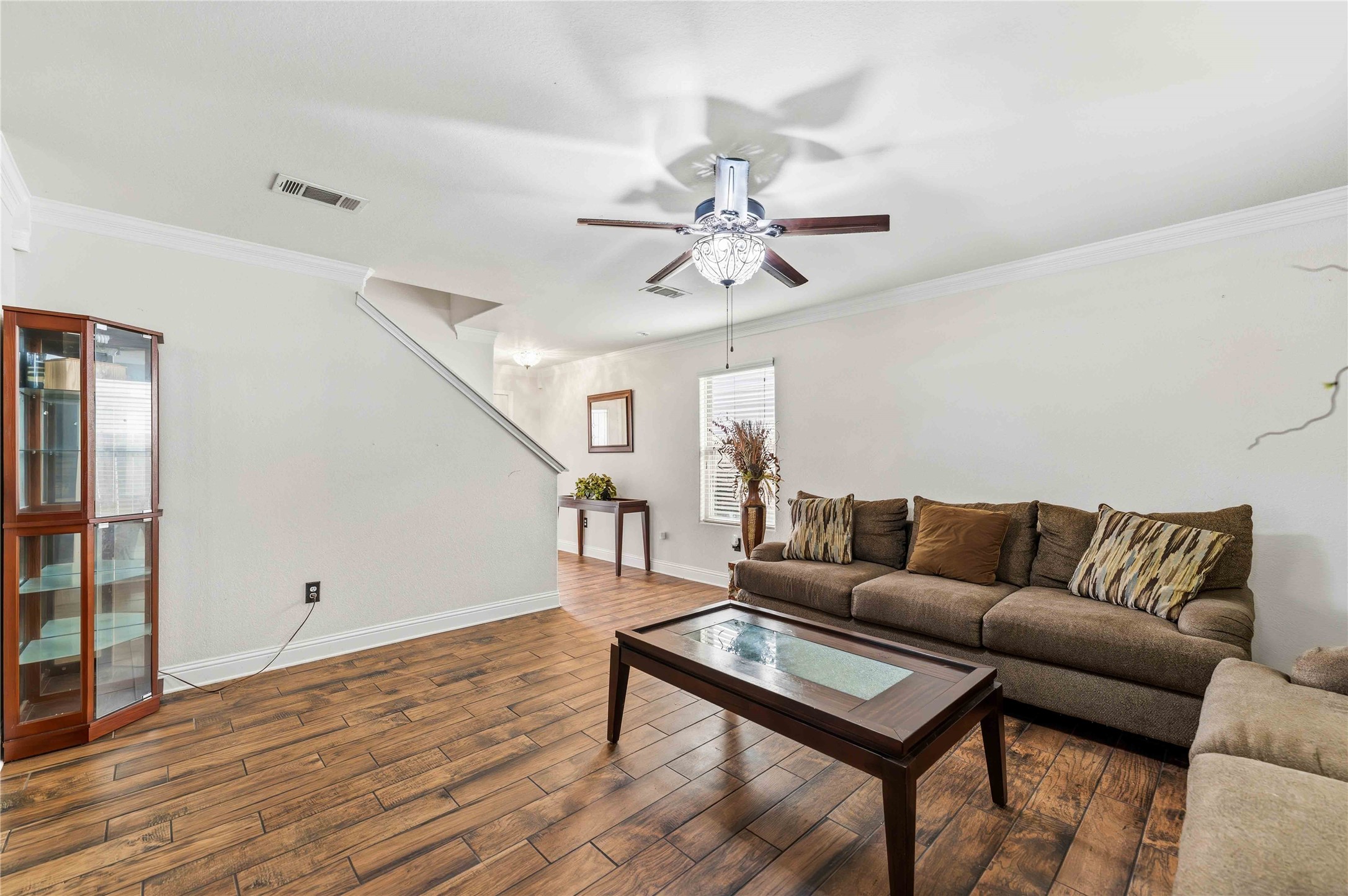 10114 Orchid Spring Lane Houston, TX 77044 - Photo 4 of 22 a living room with furniture and wooden floor