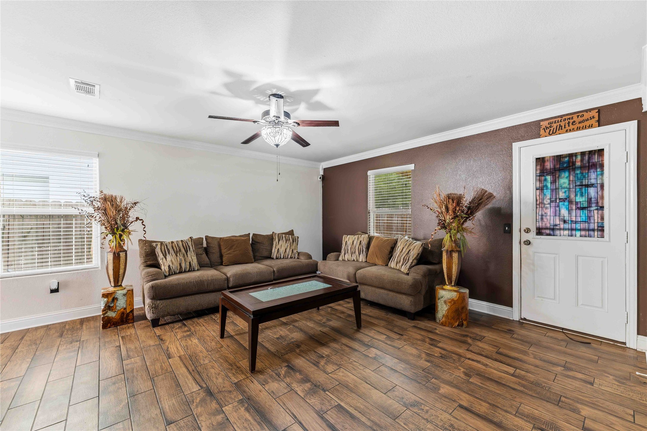 10114 Orchid Spring Lane Houston, TX 77044 - Photo 6 of 22 a living room with furniture and a wooden floor