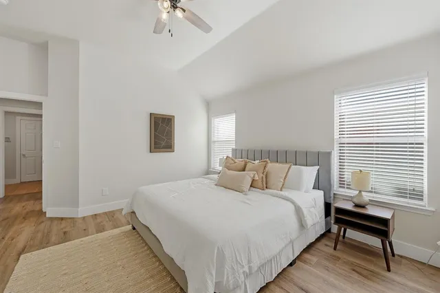 a bed room with a bed and a chandelier