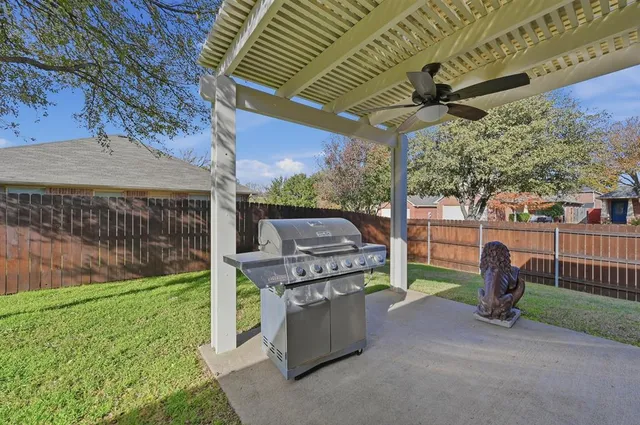 a view of a backyard with couches