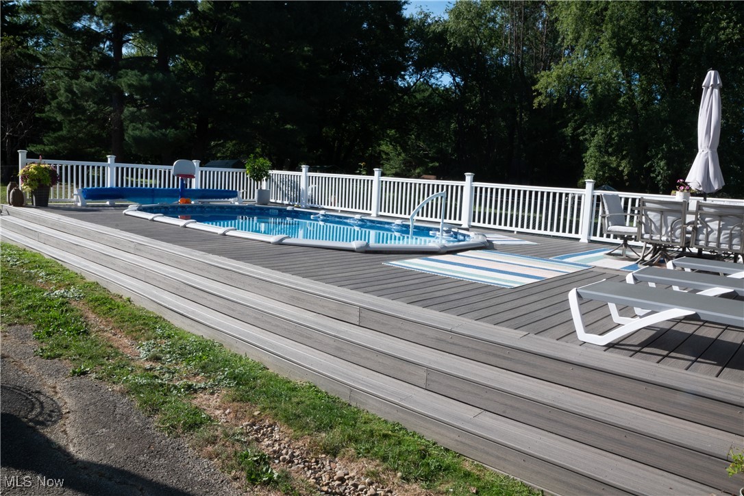 95 Clingan Road Struthers, OH 44471 - Photo 13 of 46 View of pool with a deck and view of scattered trees