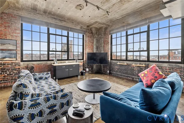 a living room with furniture and a flat screen tv