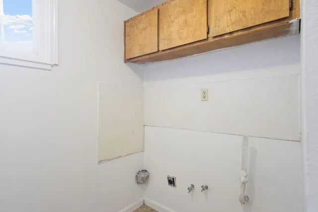 a bathroom with a shower and cabinets