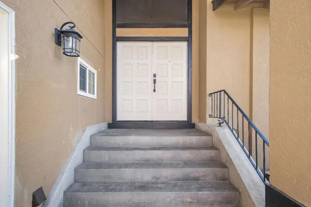 a view of staircase with white walls