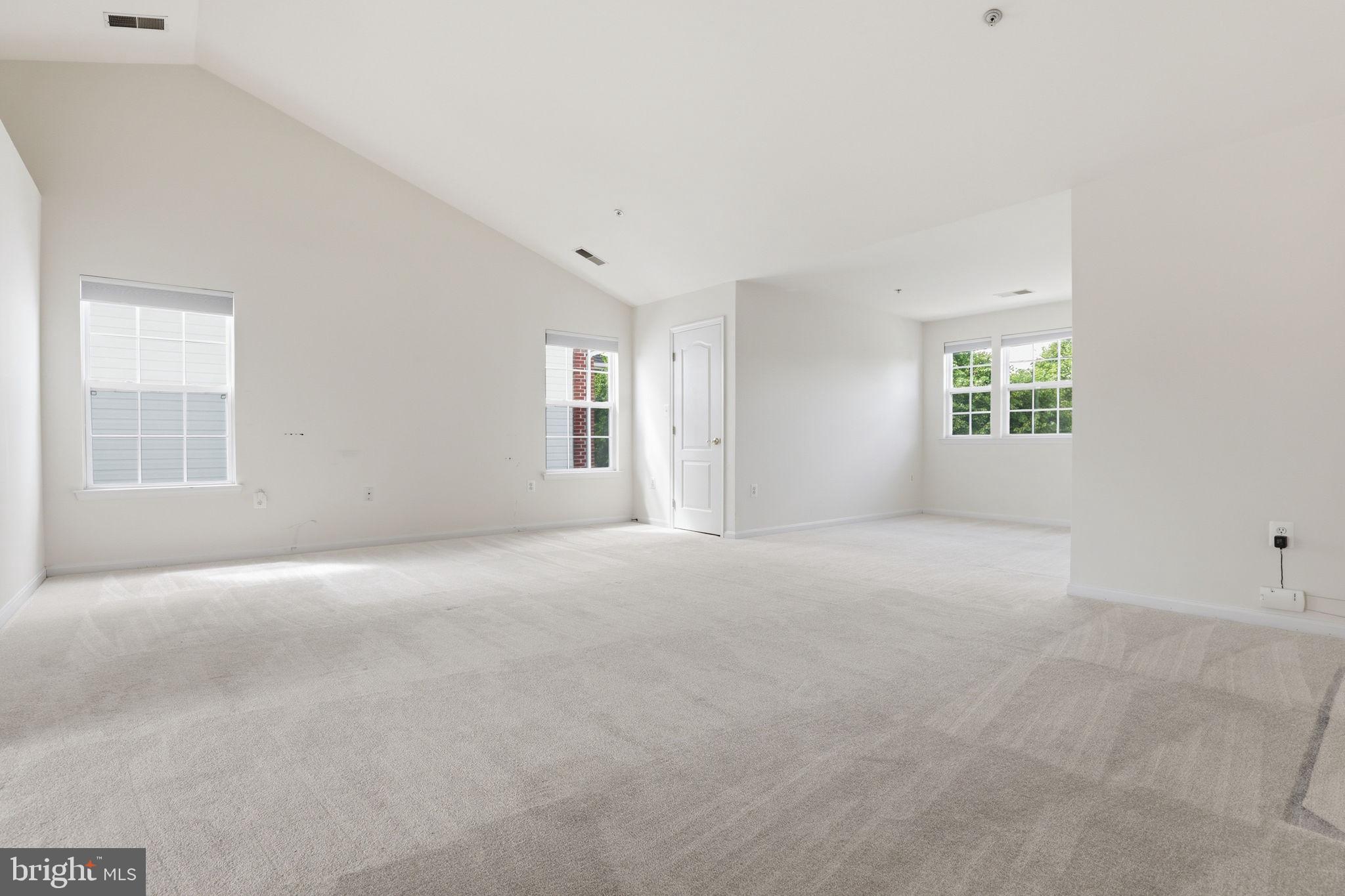10105 Elgin Circle Bowie, MD 20721 - Photo 15 of 32 a view of a big room with windows and chandelier fan
