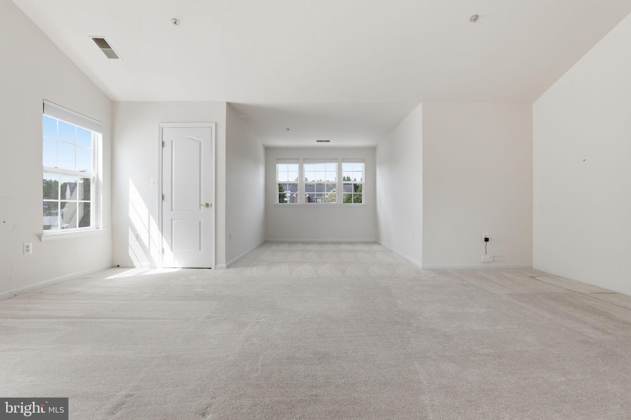 10105 Elgin Circle Bowie, MD 20721 - Photo 17 of 32 a view of an empty room with windows