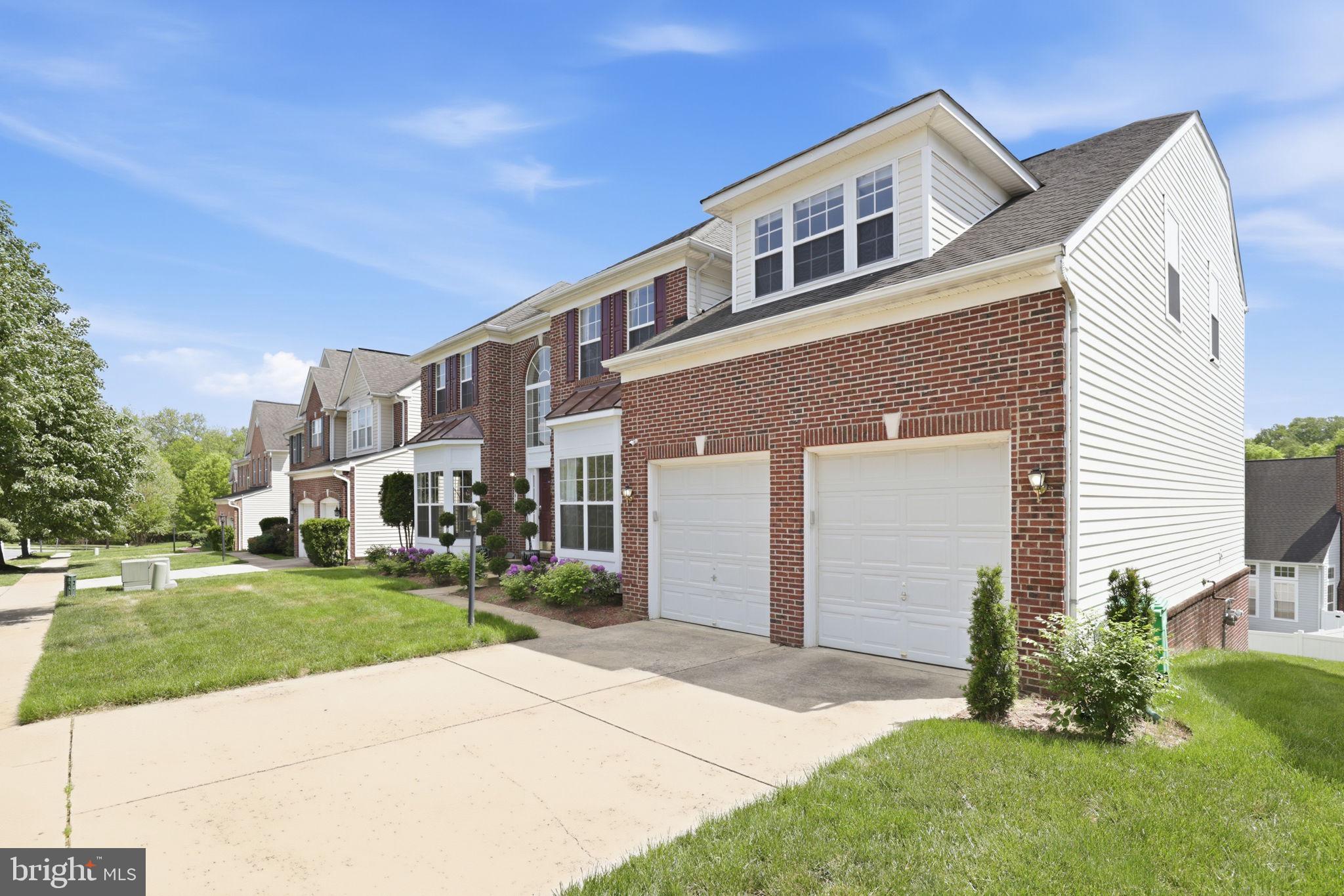 10105 Elgin Circle Bowie, MD 20721 - Photo 2 of 32 a front view of a house with a yard