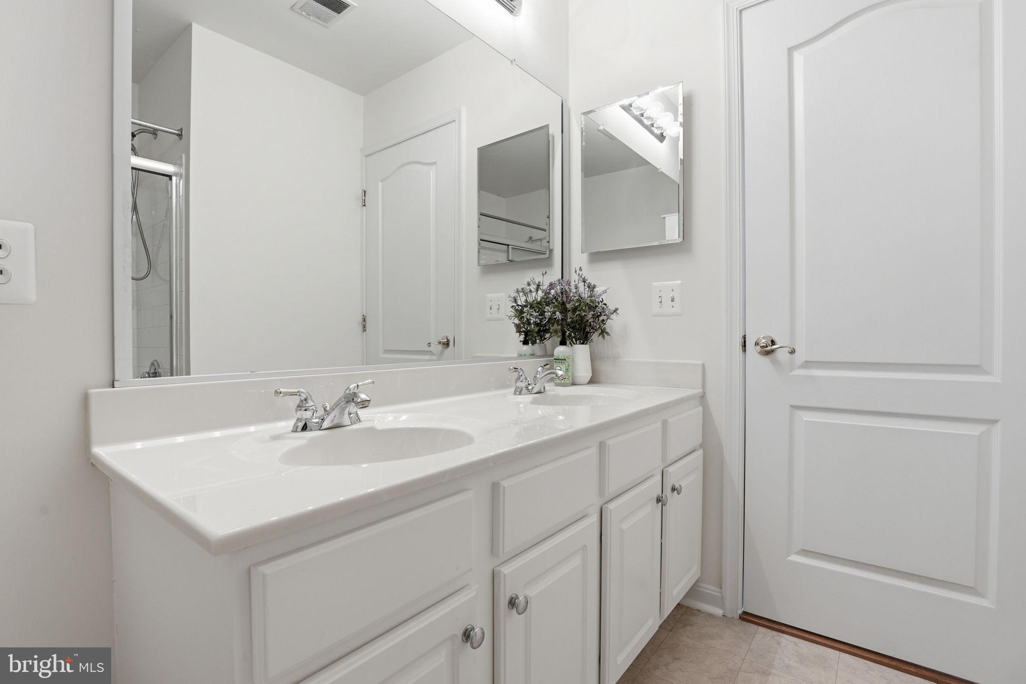 10105 Elgin Circle Bowie, MD 20721 - Photo 21 of 32 a bathroom with a sink and a mirror