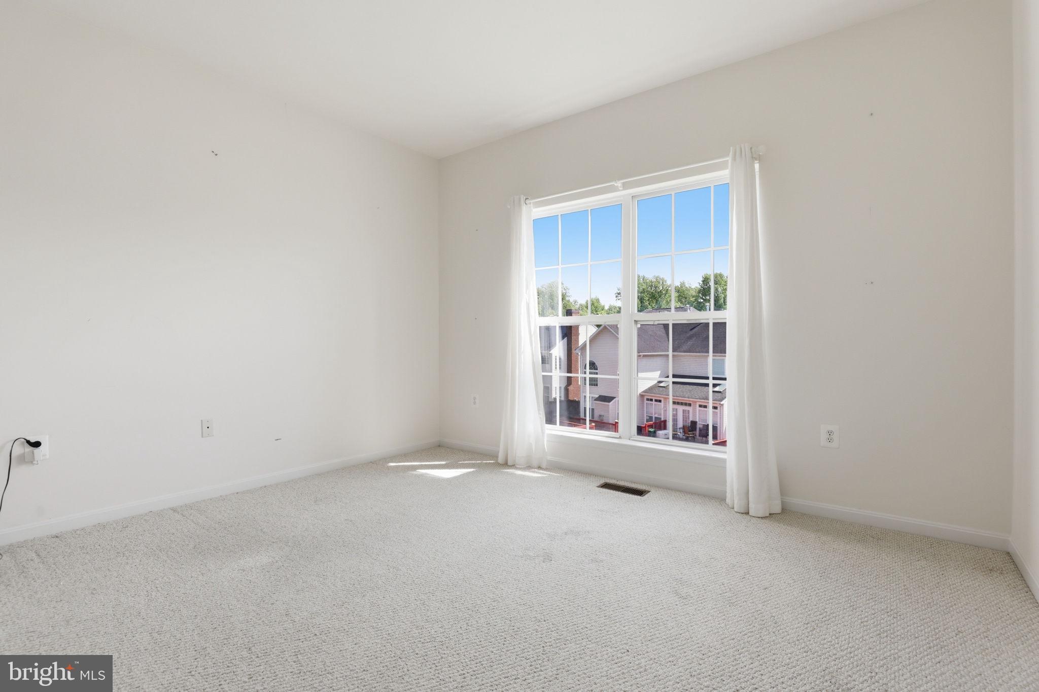 10105 Elgin Circle Bowie, MD 20721 - Photo 22 of 32 a view of an empty room with a window