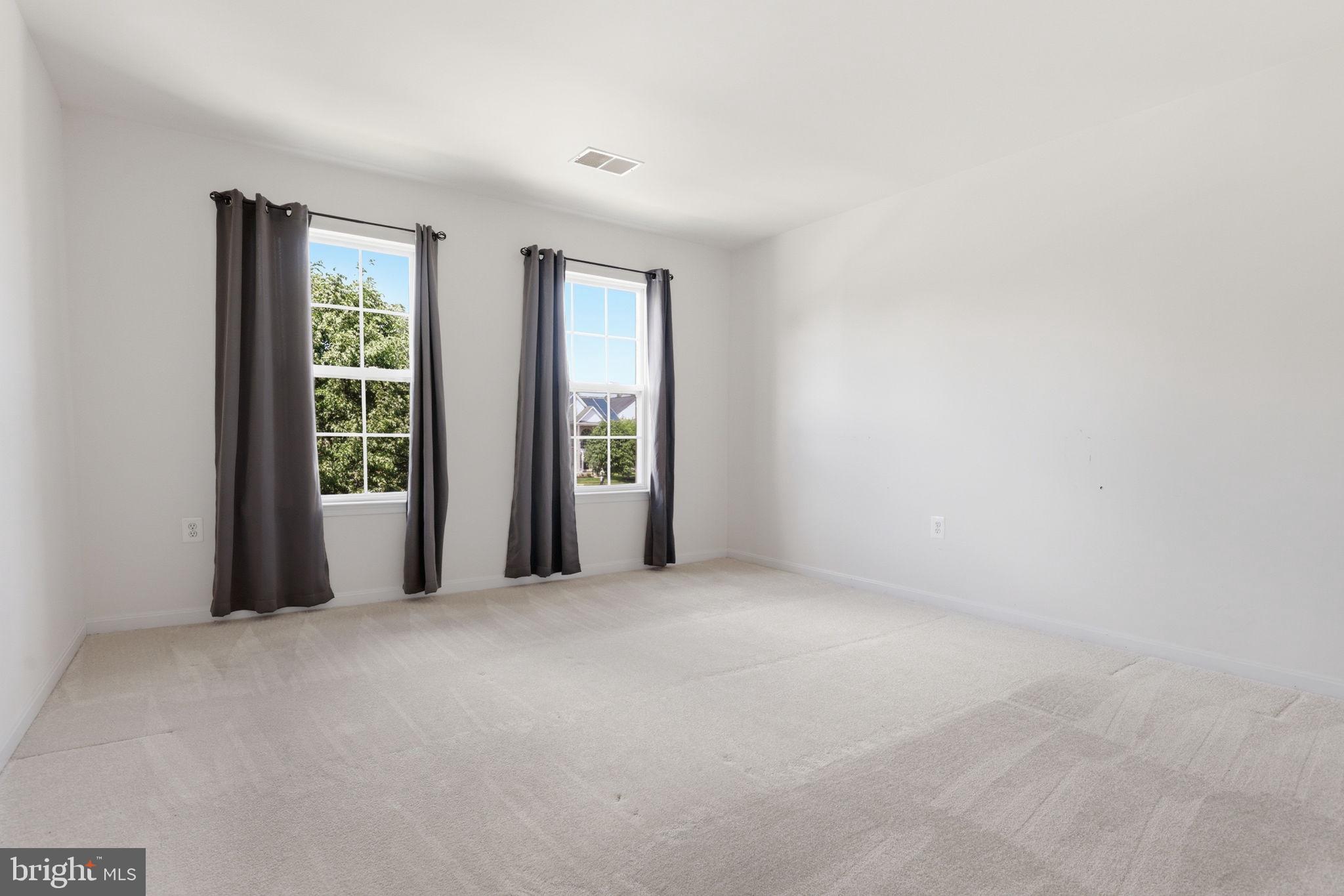 10105 Elgin Circle Bowie, MD 20721 - Photo 26 of 32 a view of an empty room with large windows
