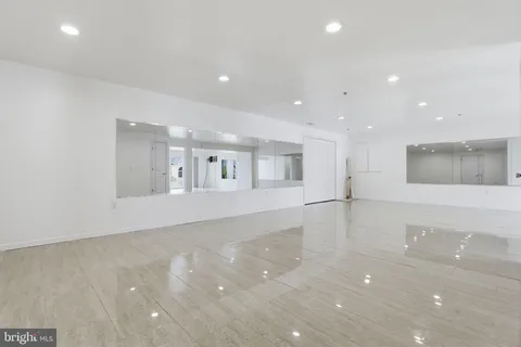 a kitchen with stainless steel appliances granite countertop a sink and a refrigerator