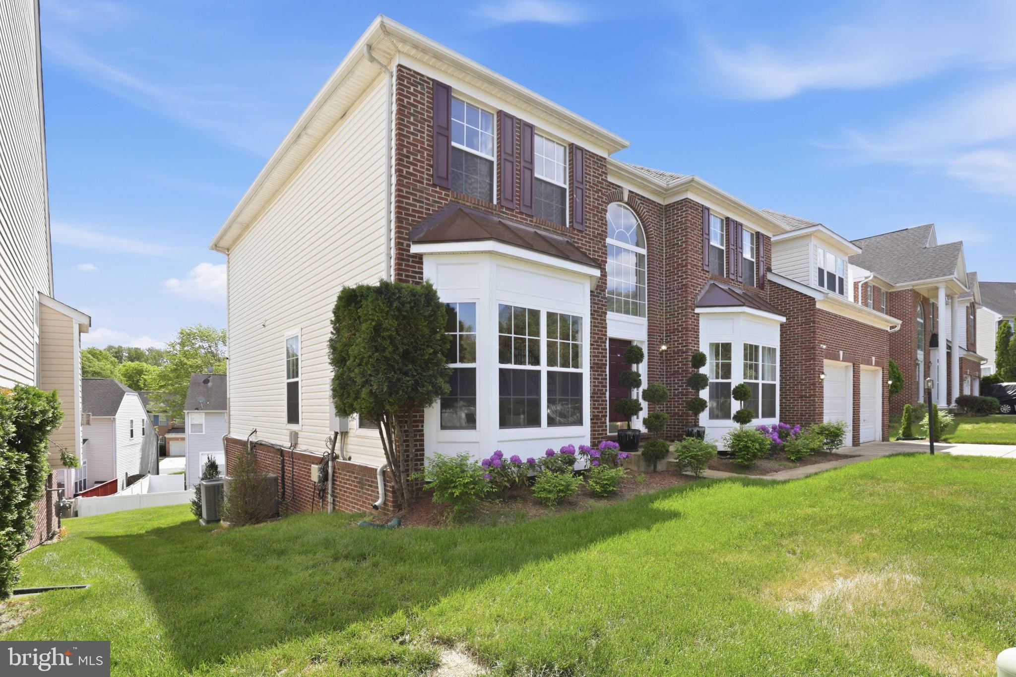 10105 Elgin Circle Bowie, MD 20721 - Photo 3 of 32 a front view of building with yard and green space