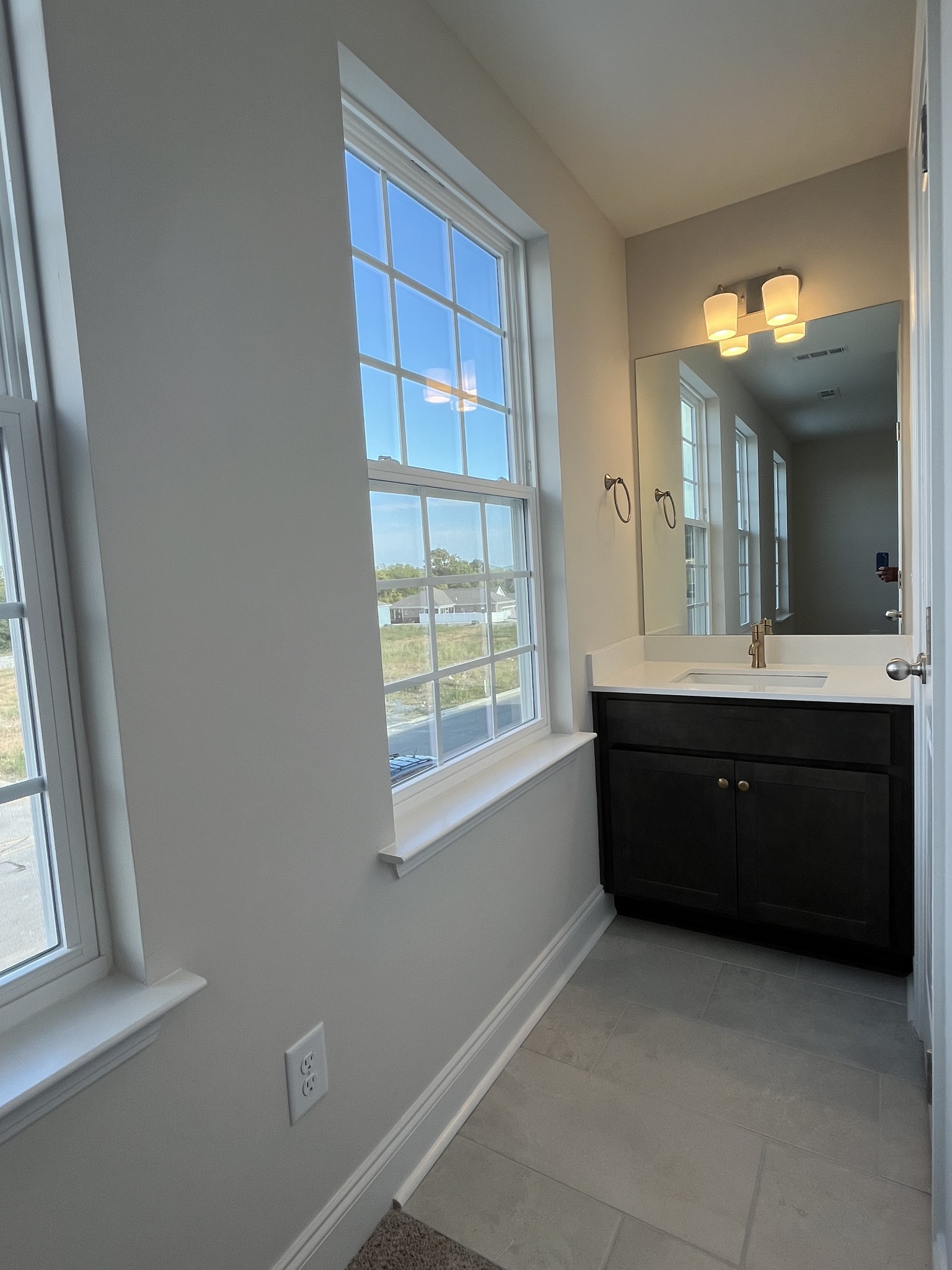 3232 Tasker Drive Antioch, TN 37013 - Photo 16 of 19 a room with a sink vanity and a mirror