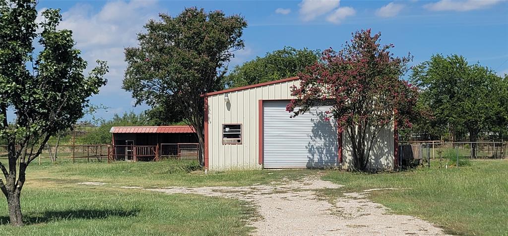 211 Bayne Road Haslet, TX 76052 - Photo 18 of 18 a view of a house with backyard and a tree