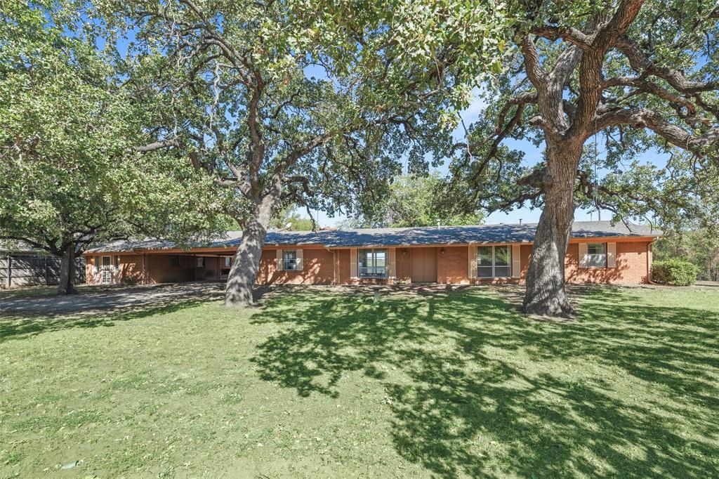3055 Midway Road Grapevine, TX 76092 - Photo 3 of 40 a house view with a garden space