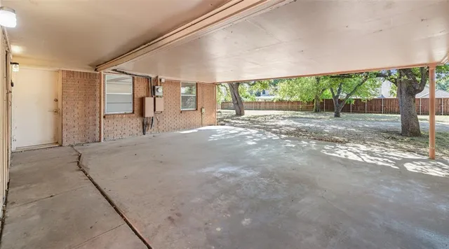 a view of a house with a backyard and floor to ceiling window