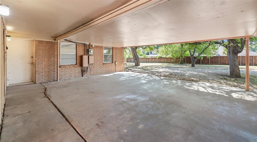 3055 Midway Road Grapevine, TX 76092 - Photo 38 of 40 a view of a house with a backyard and floor to ceiling window