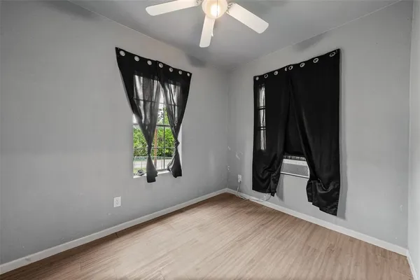 a view of an entryway with wooden floor