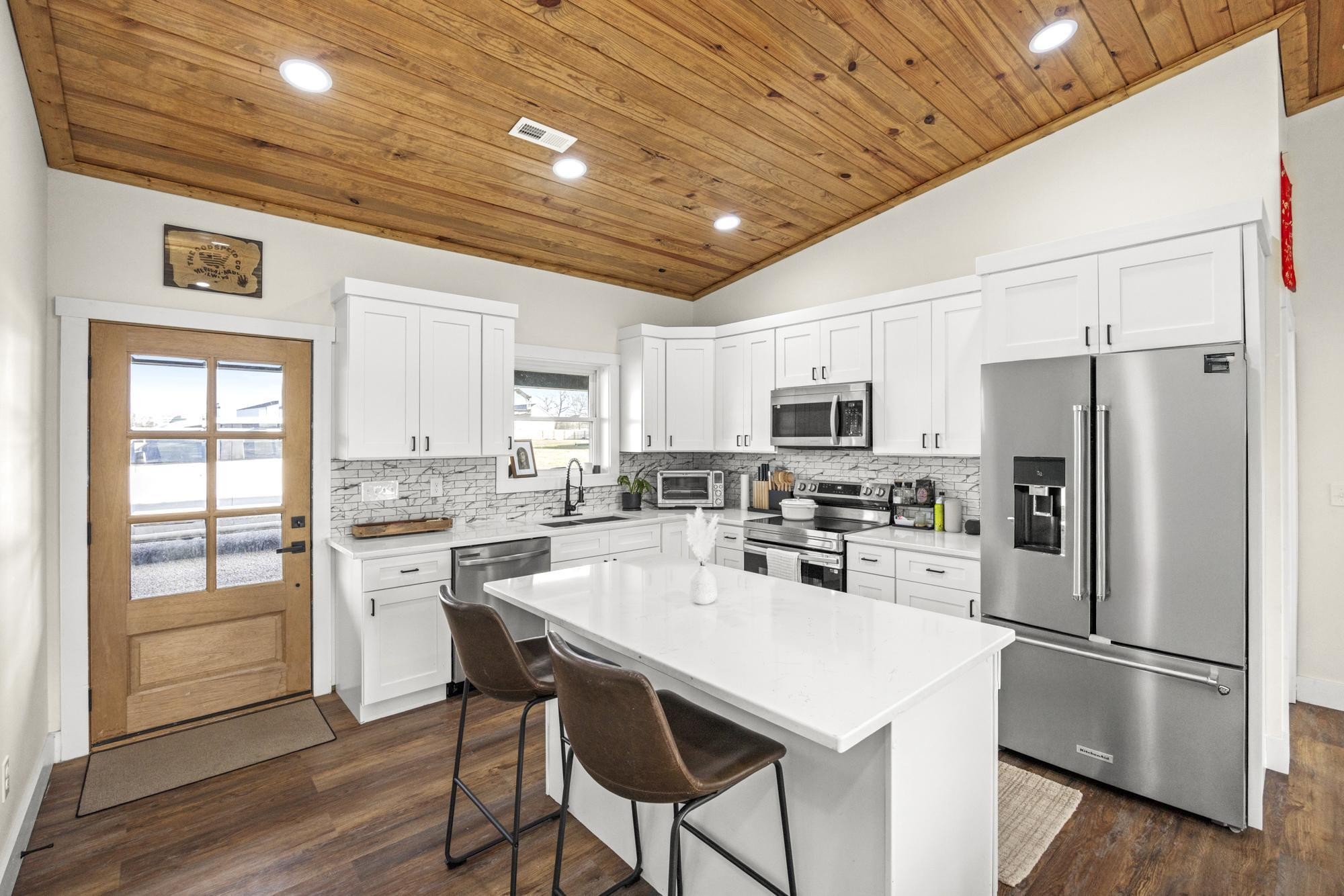 154 North Old Military Road Summertown, TN 38483 - Photo 12 of 45 a kitchen with stainless steel appliances a refrigerator sink and microwave