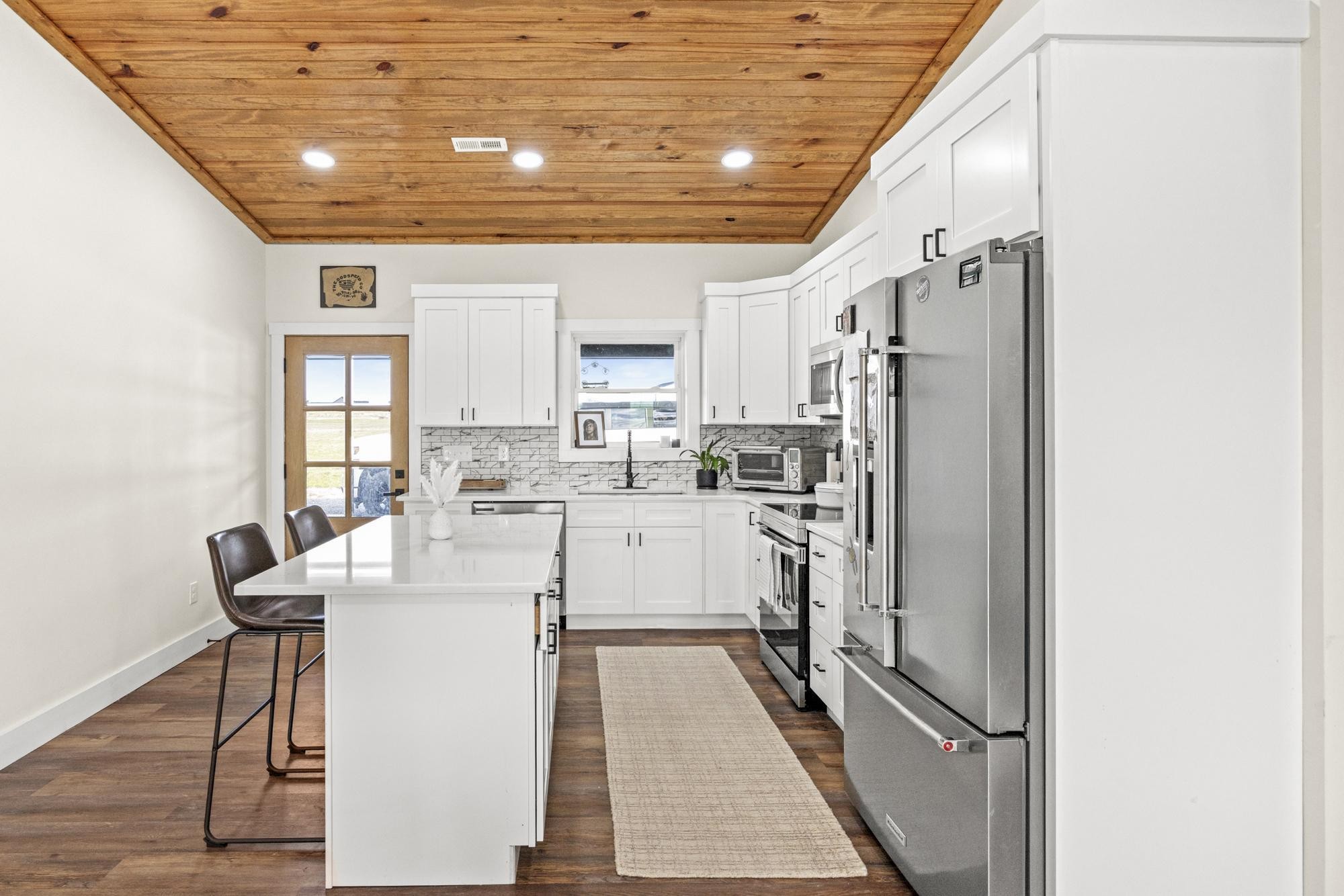 154 North Old Military Road Summertown, TN 38483 - Photo 13 of 45 a kitchen with stainless steel appliances granite countertop a refrigerator and a stove top oven