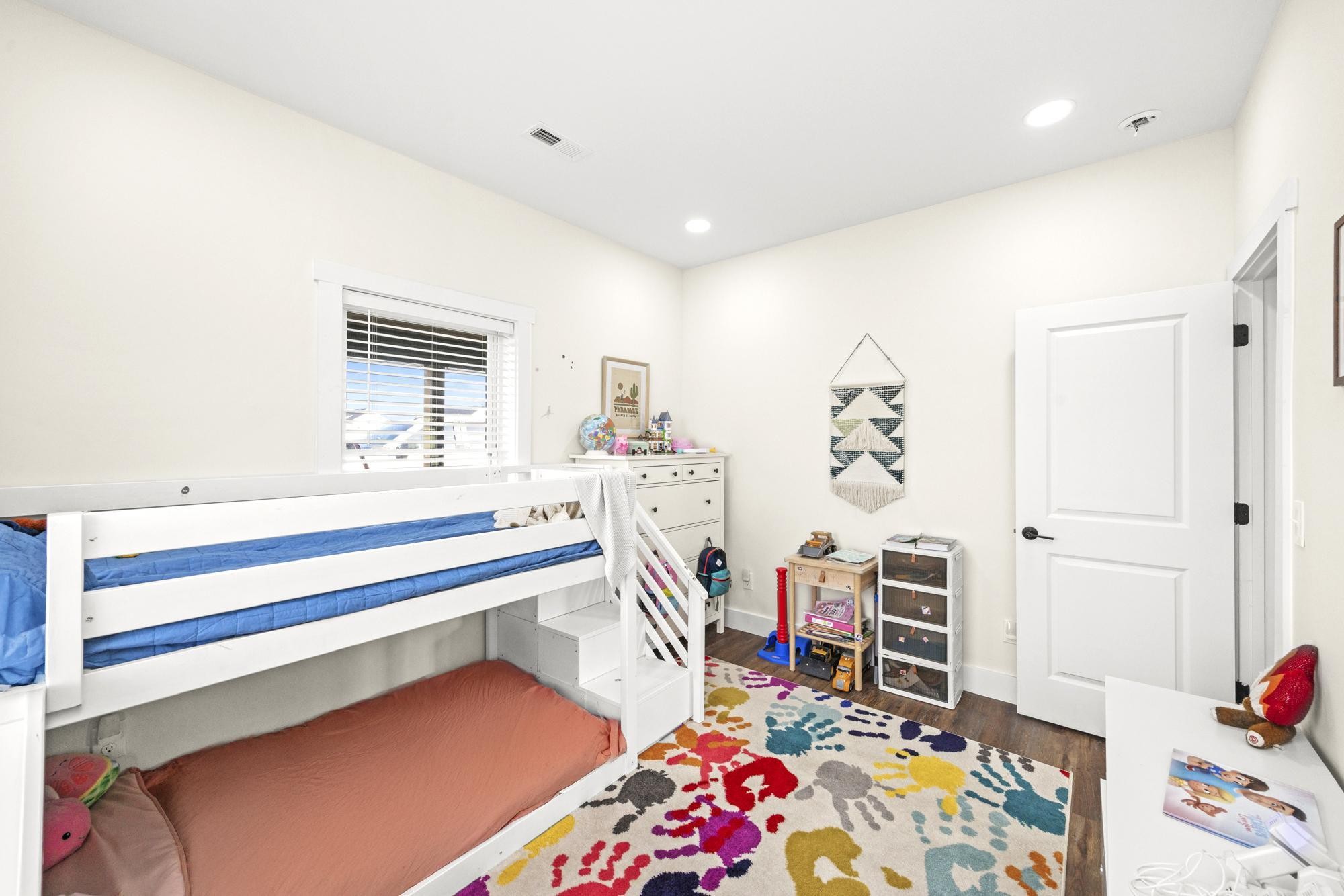 154 North Old Military Road Summertown, TN 38483 - Photo 23 of 45 a bedroom with furniture and a wooden floor