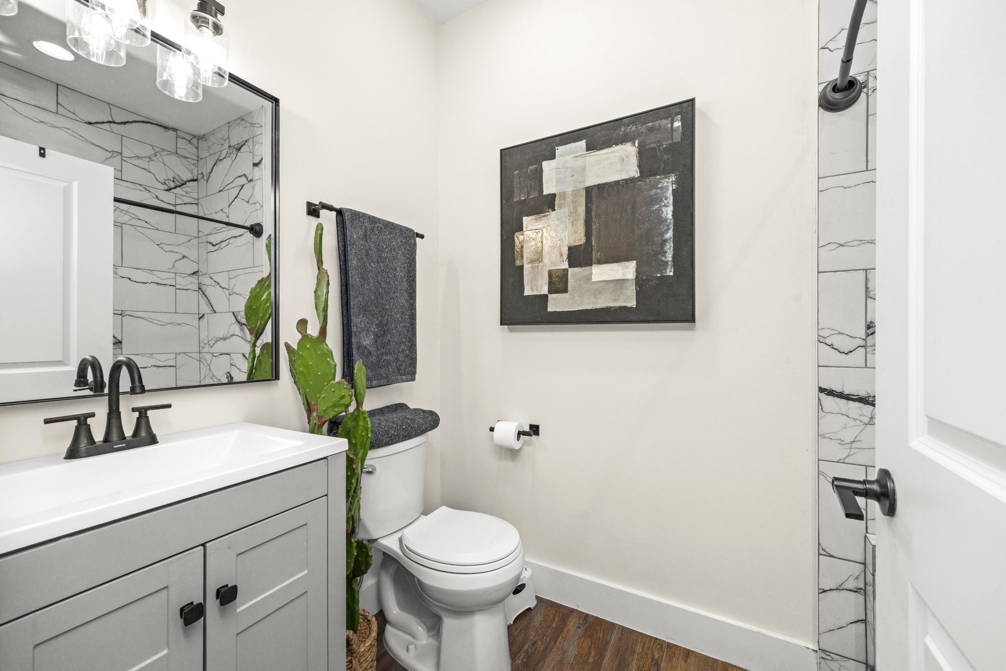 154 North Old Military Road Summertown, TN 38483 - Photo 25 of 45 a bathroom with a sink mirror vanity and toilet