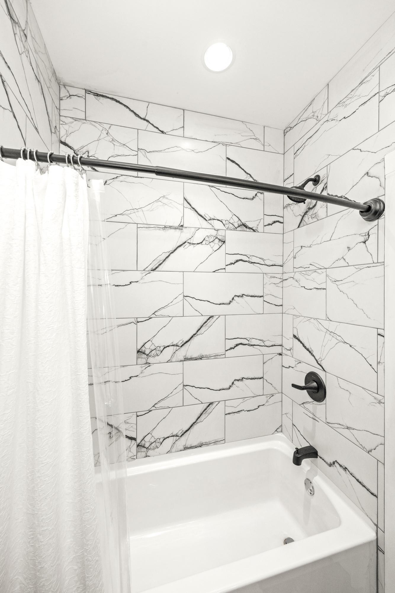 154 North Old Military Road Summertown, TN 38483 - Photo 26 of 45 a bathroom with a bathtub and shower