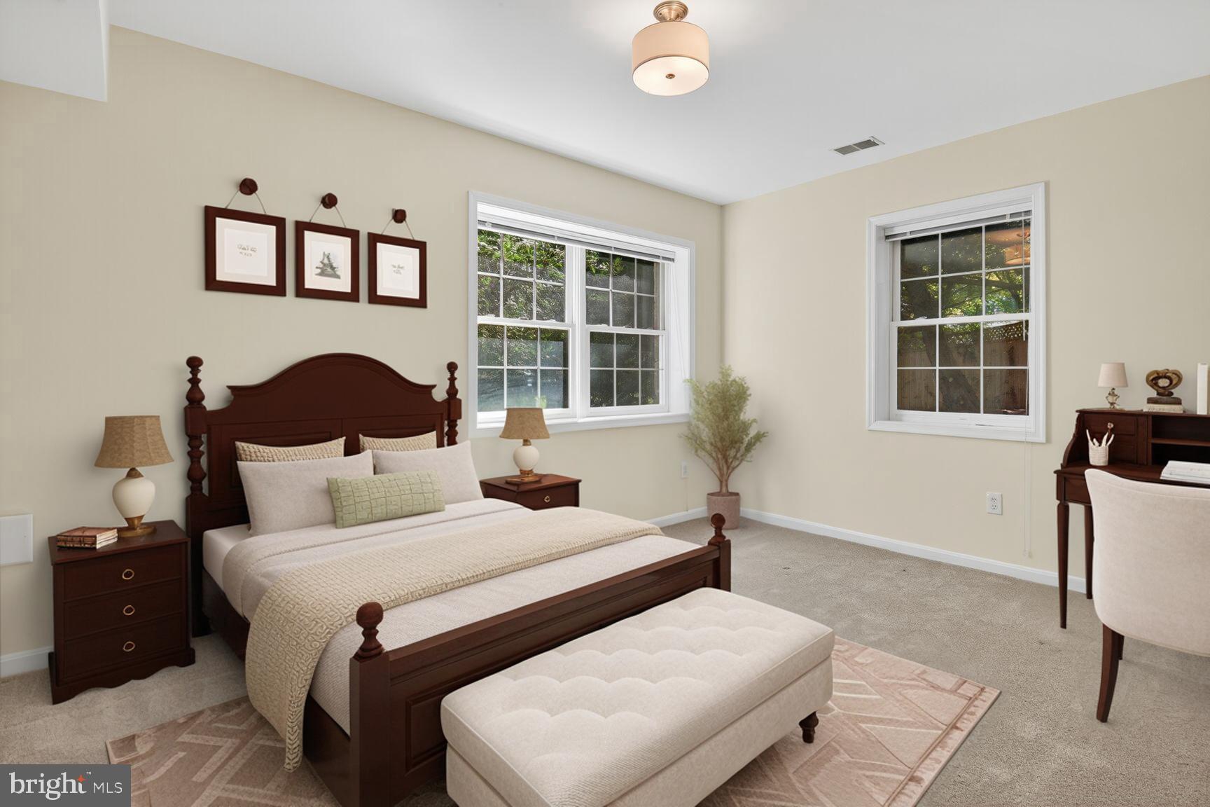 9914 Woodford Road Potomac, MD 20854 - Photo 17 of 87 a bedroom with a bed a table and chair