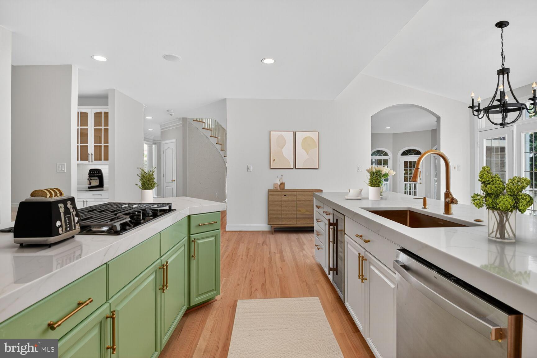 9914 Woodford Road Potomac, MD 20854 - Photo 19 of 87 a kitchen with a sink and stove