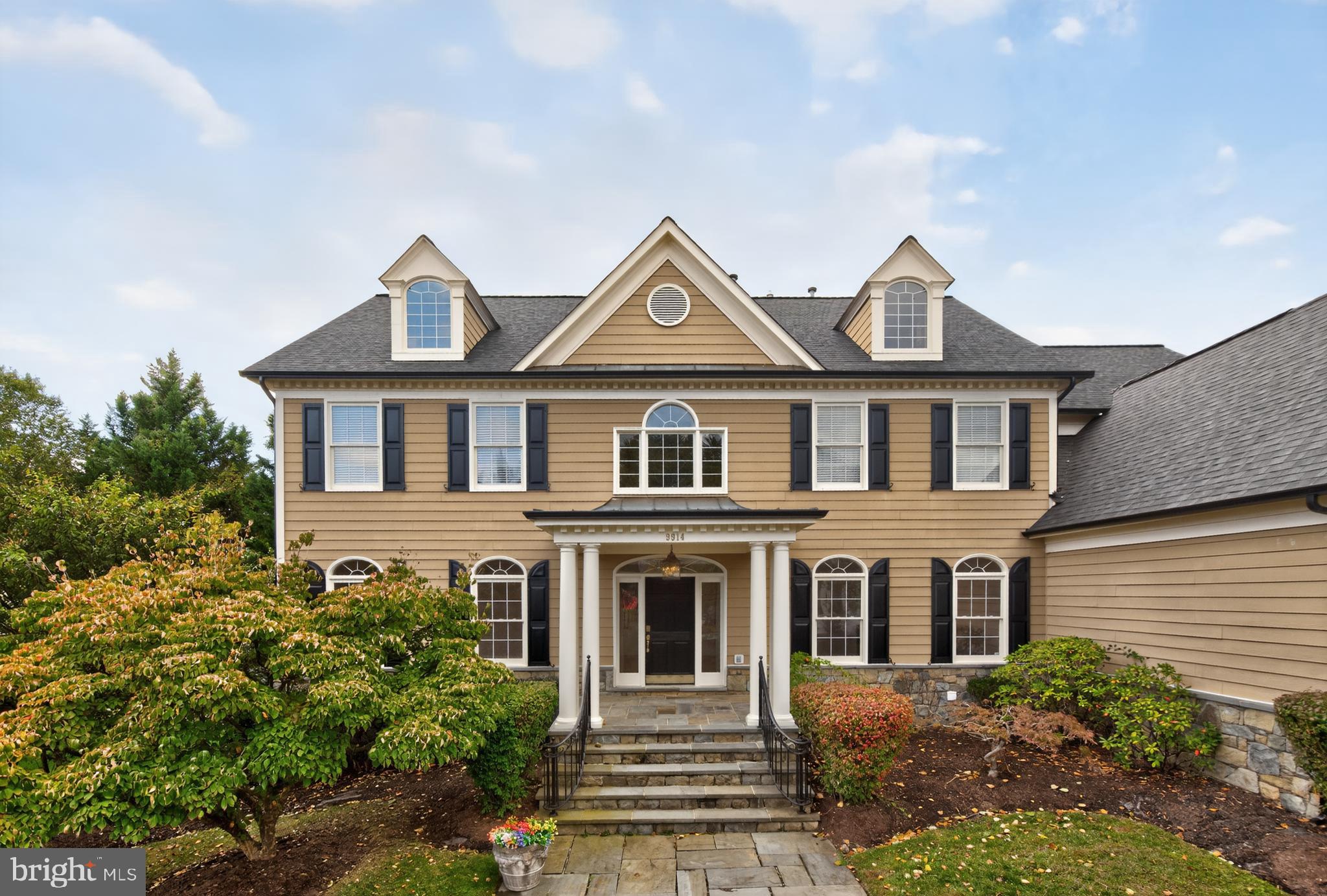 9914 Woodford Road Potomac, MD 20854 - Photo 2 of 87 a front view of a house with a garden