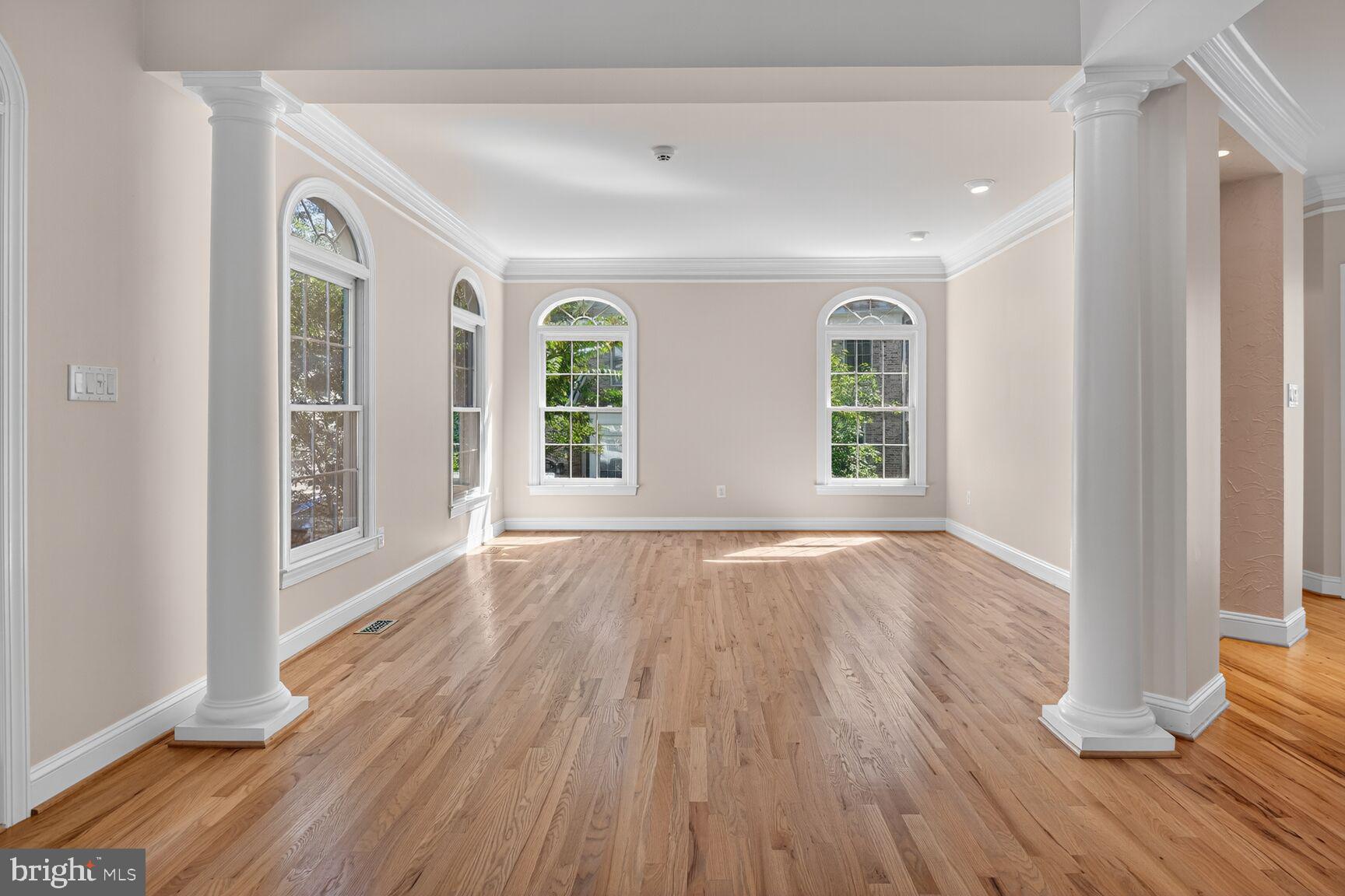 9914 Woodford Road Potomac, MD 20854 - Photo 22 of 87 an empty room with wooden floor and windows
