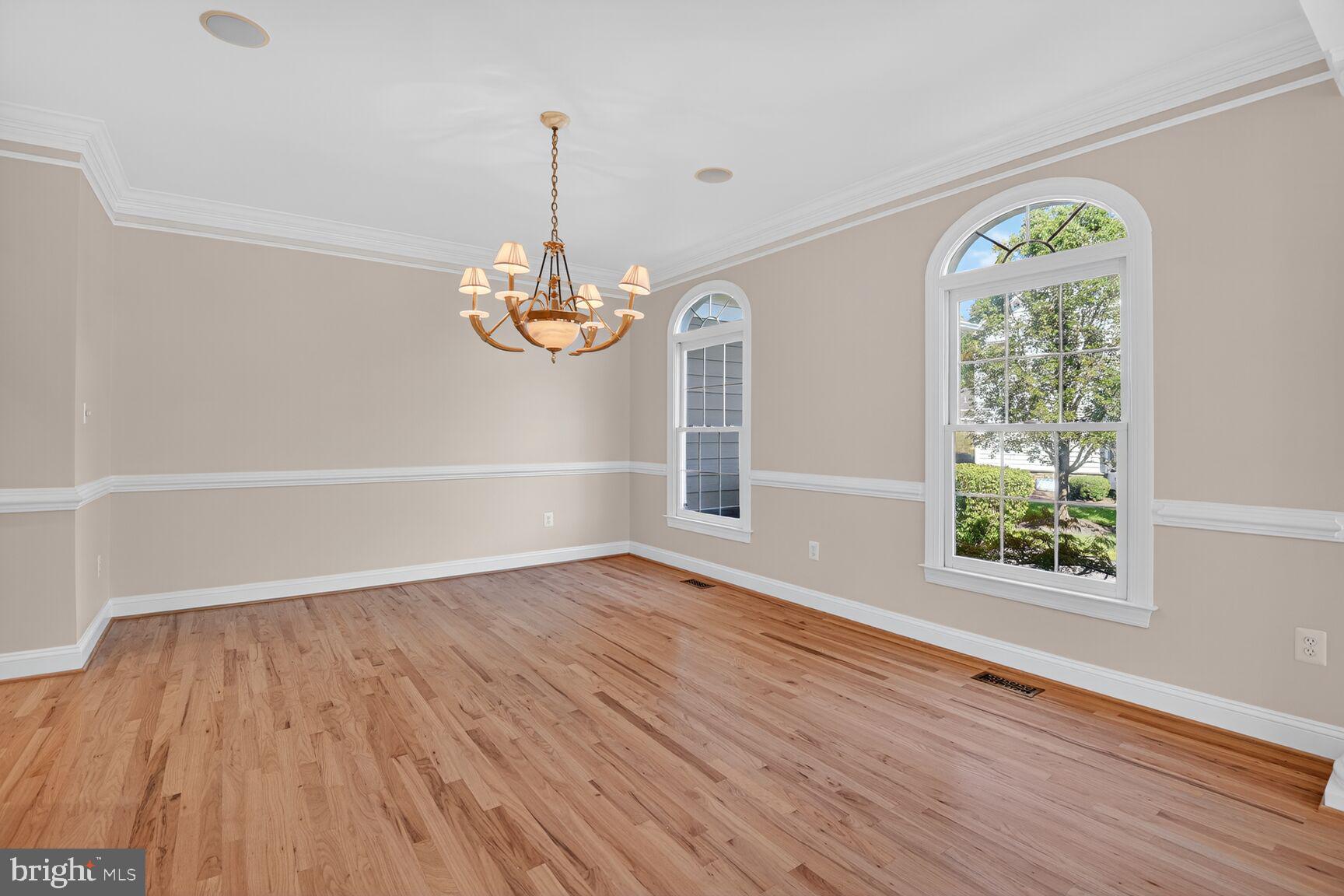 9914 Woodford Road Potomac, MD 20854 - Photo 26 of 87 wooden floor in an empty room with a window