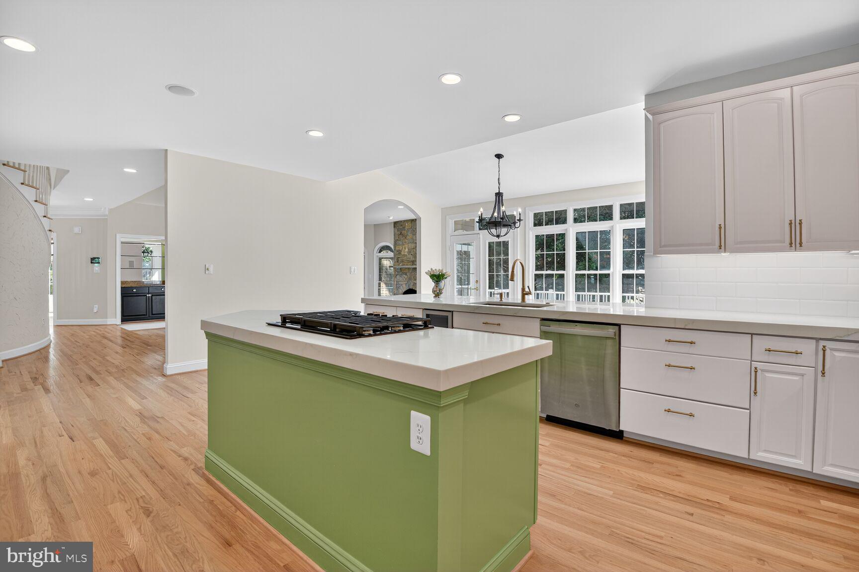 9914 Woodford Road Potomac, MD 20854 - Photo 48 of 87 a kitchen with a stove and a sink