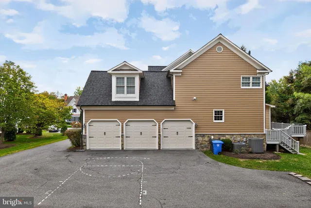 a view of a house with a yard and deck