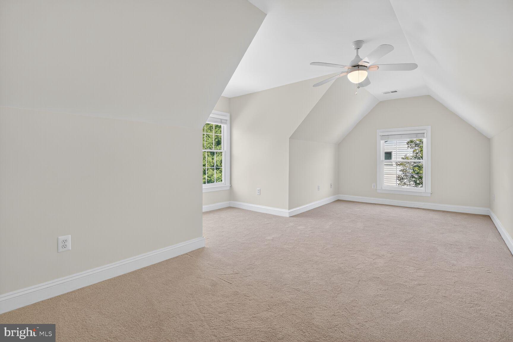 9914 Woodford Road Potomac, MD 20854 - Photo 52 of 87 an empty room with windows and fan