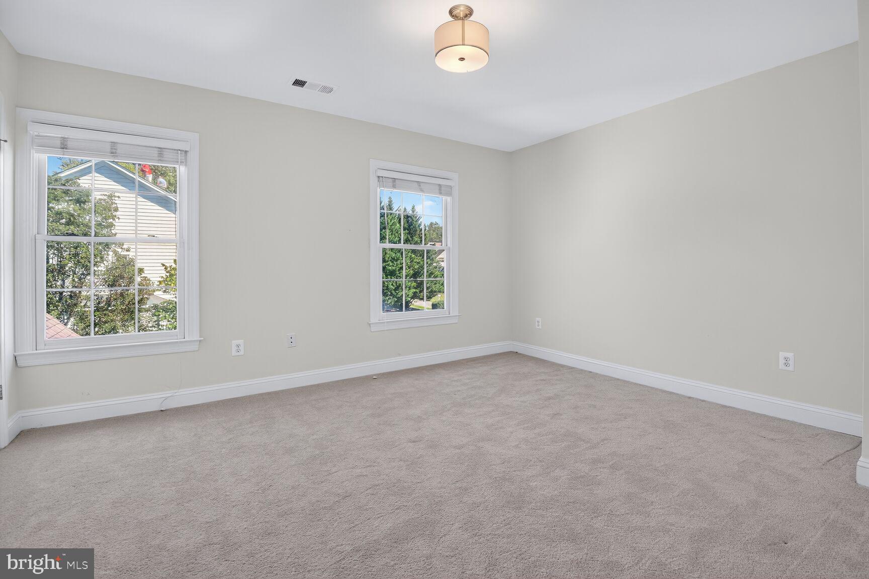 9914 Woodford Road Potomac, MD 20854 - Photo 56 of 87 an empty room with windows