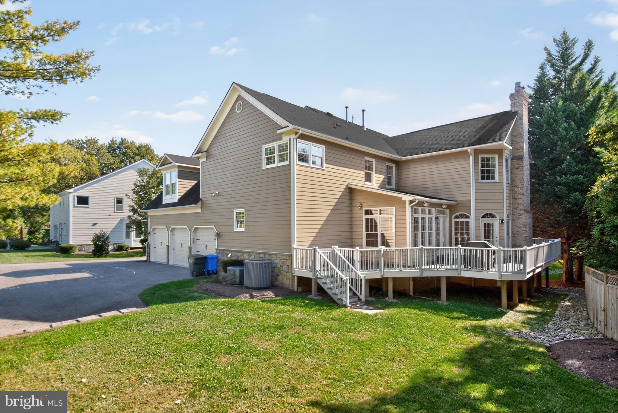 9914 Woodford Road Potomac, MD 20854 - Photo 79 of 87 a front view of a house with a garden and porch