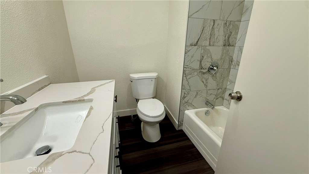 4542 Bandini Avenue Riverside, CA 92506 - Photo 16 of 22 a bathroom with a toilet and a shower