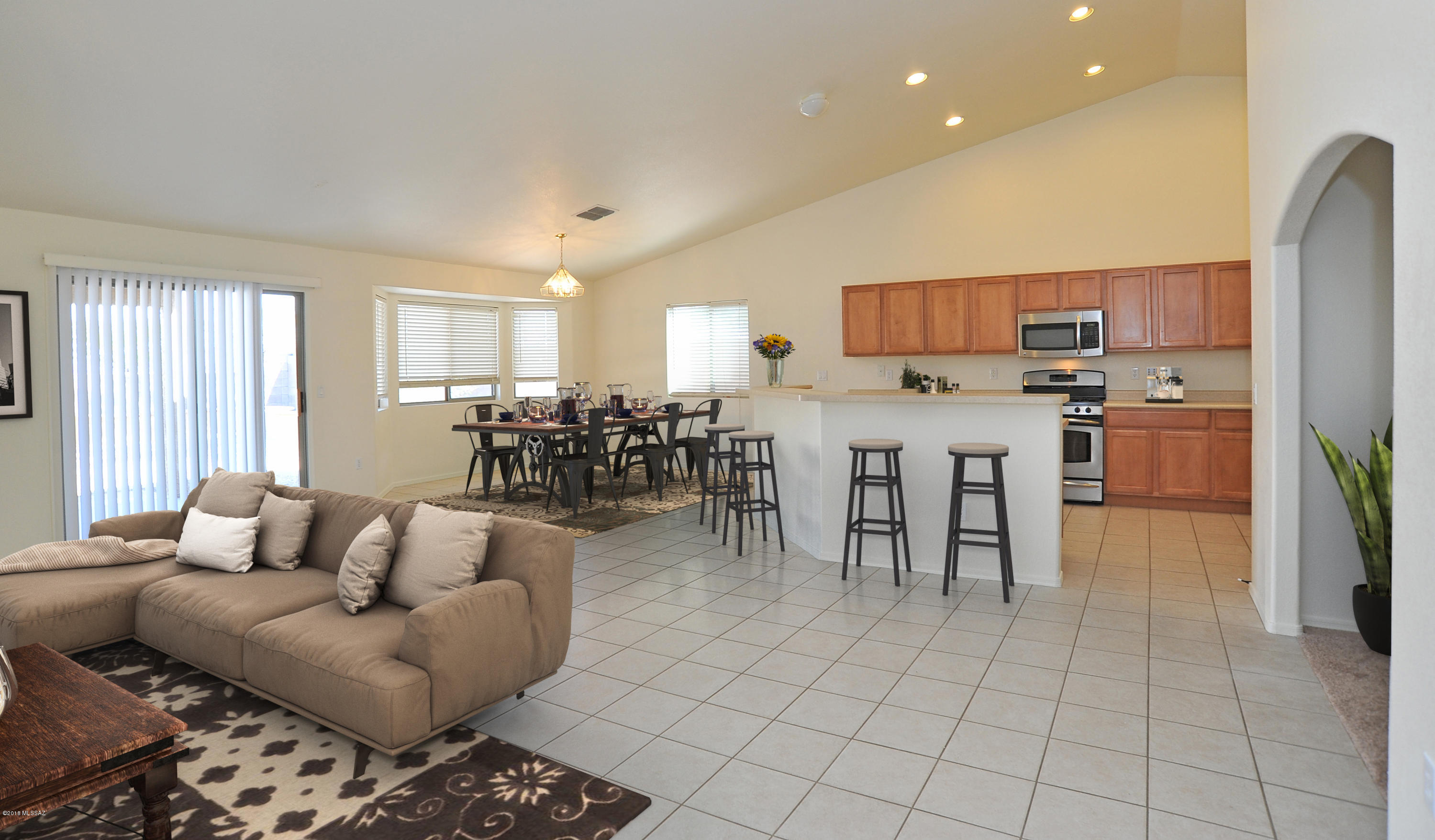 558 West Chatfield Street Vail, AZ 85641 - Photo 2 of 31 a living room with stainless steel appliances kitchen island granite countertop furniture and a view of kitchen
