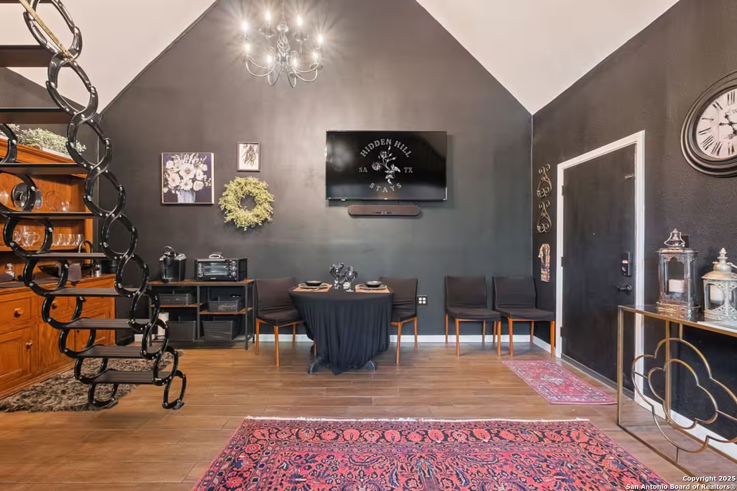 24159 Boerne Stage Road San Antonio, TX 78255 - Photo 17 of 100 a living room with furniture a rug and paintings on the wall