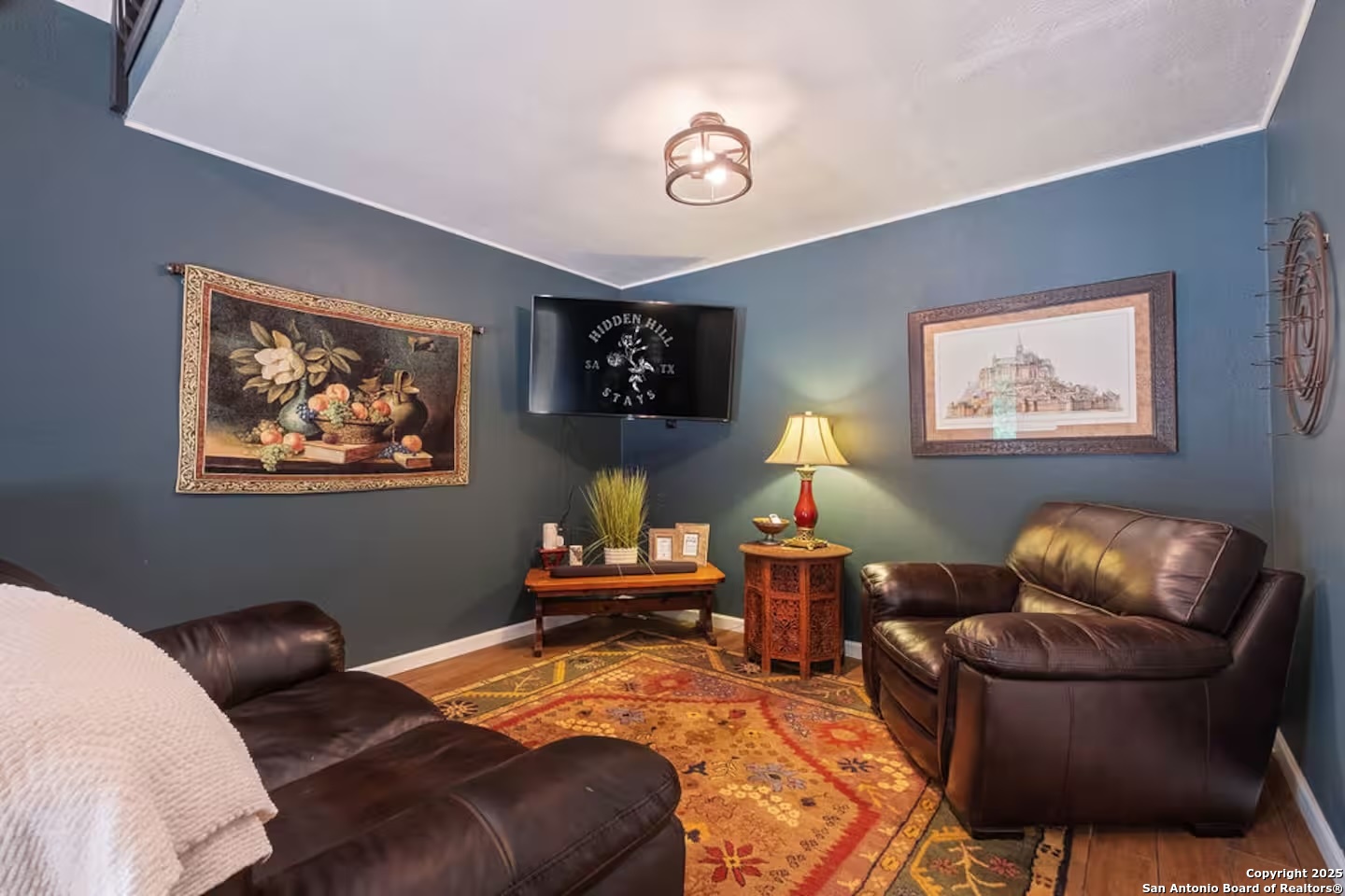 24159 Boerne Stage Road San Antonio, TX 78255 - Photo 25 of 100 a bedroom with bed and a couch