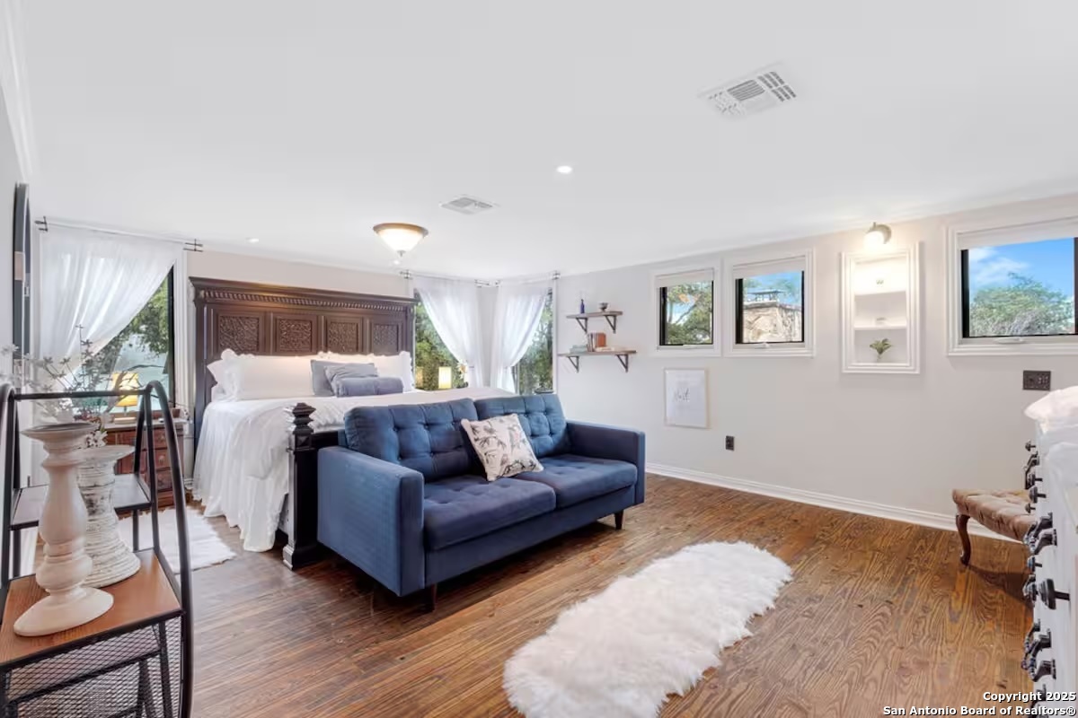 24159 Boerne Stage Road San Antonio, TX 78255 - Photo 37 of 100 a living room with furniture and wooden floor