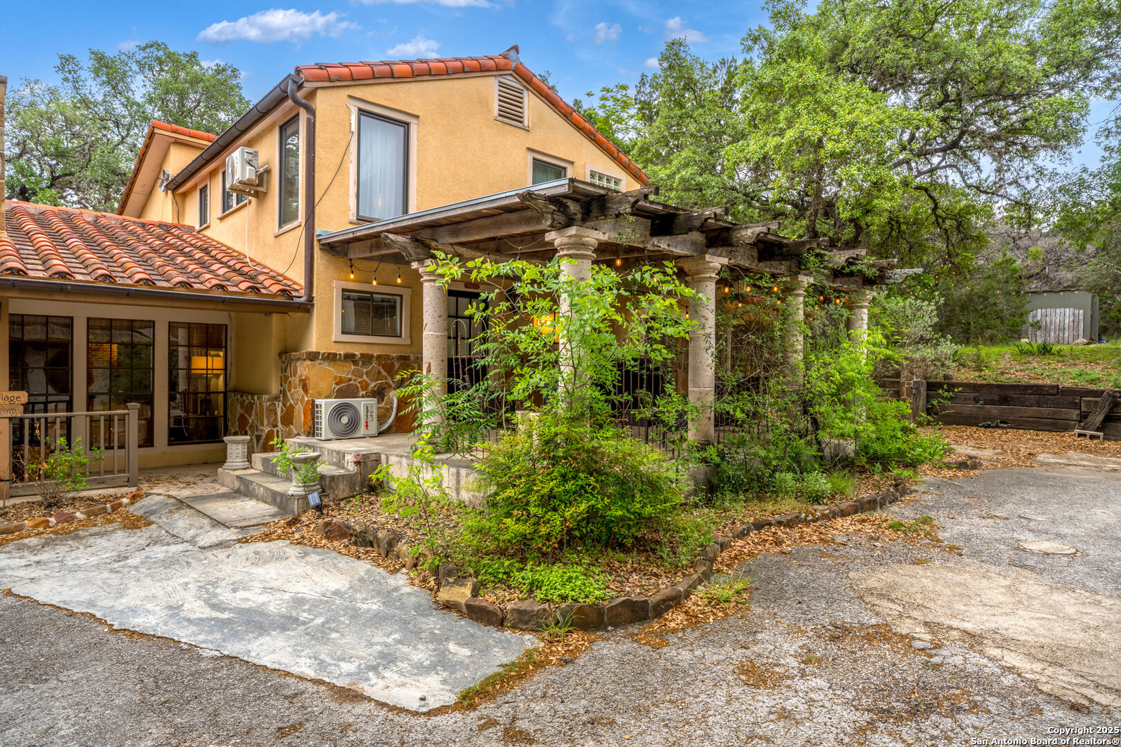 24159 Boerne Stage Road San Antonio, TX 78255 - Photo 54 of 100 a backyard of a house with yard and outdoor seating