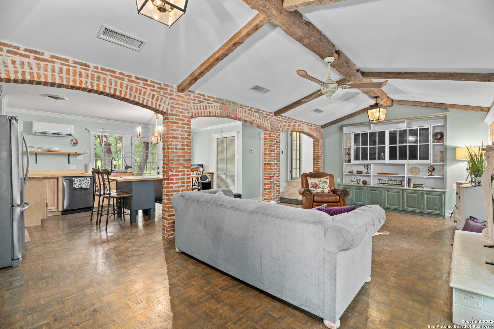 24159 Boerne Stage Road San Antonio, TX 78255 - Photo 56 of 100 a living room with furniture a dining table and chairs with wooden floor