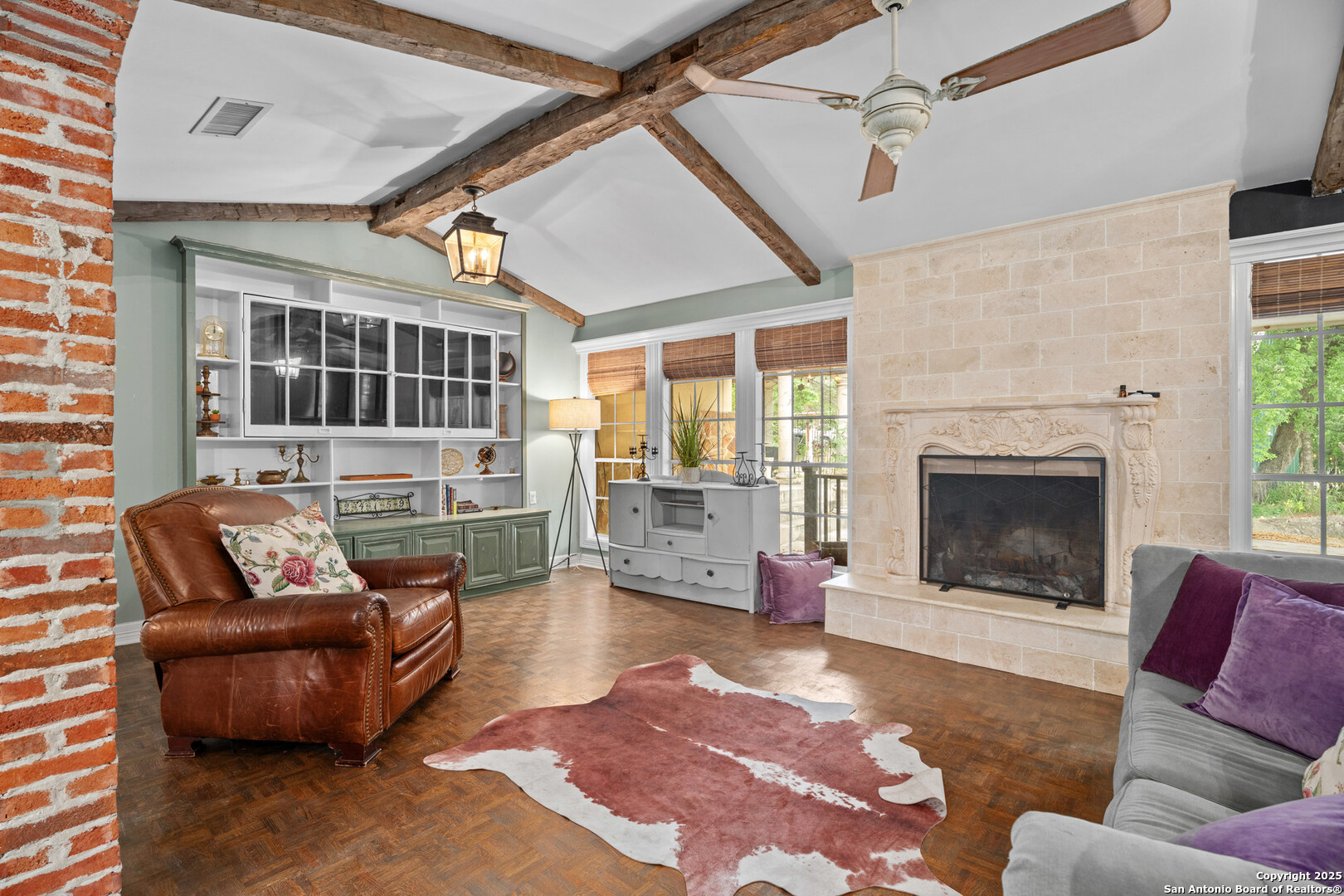 24159 Boerne Stage Road San Antonio, TX 78255 - Photo 59 of 100 a living room with furniture and a fireplace