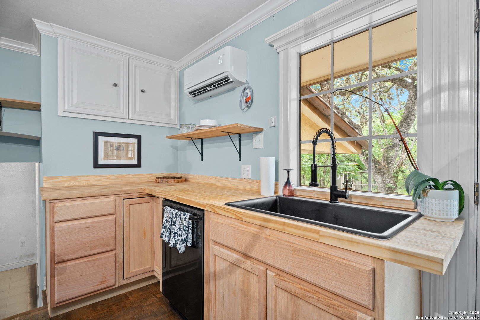 24159 Boerne Stage Road San Antonio, TX 78255 - Photo 68 of 100 a kitchen with stainless steel appliances granite countertop a sink and a white cabinets next to a window