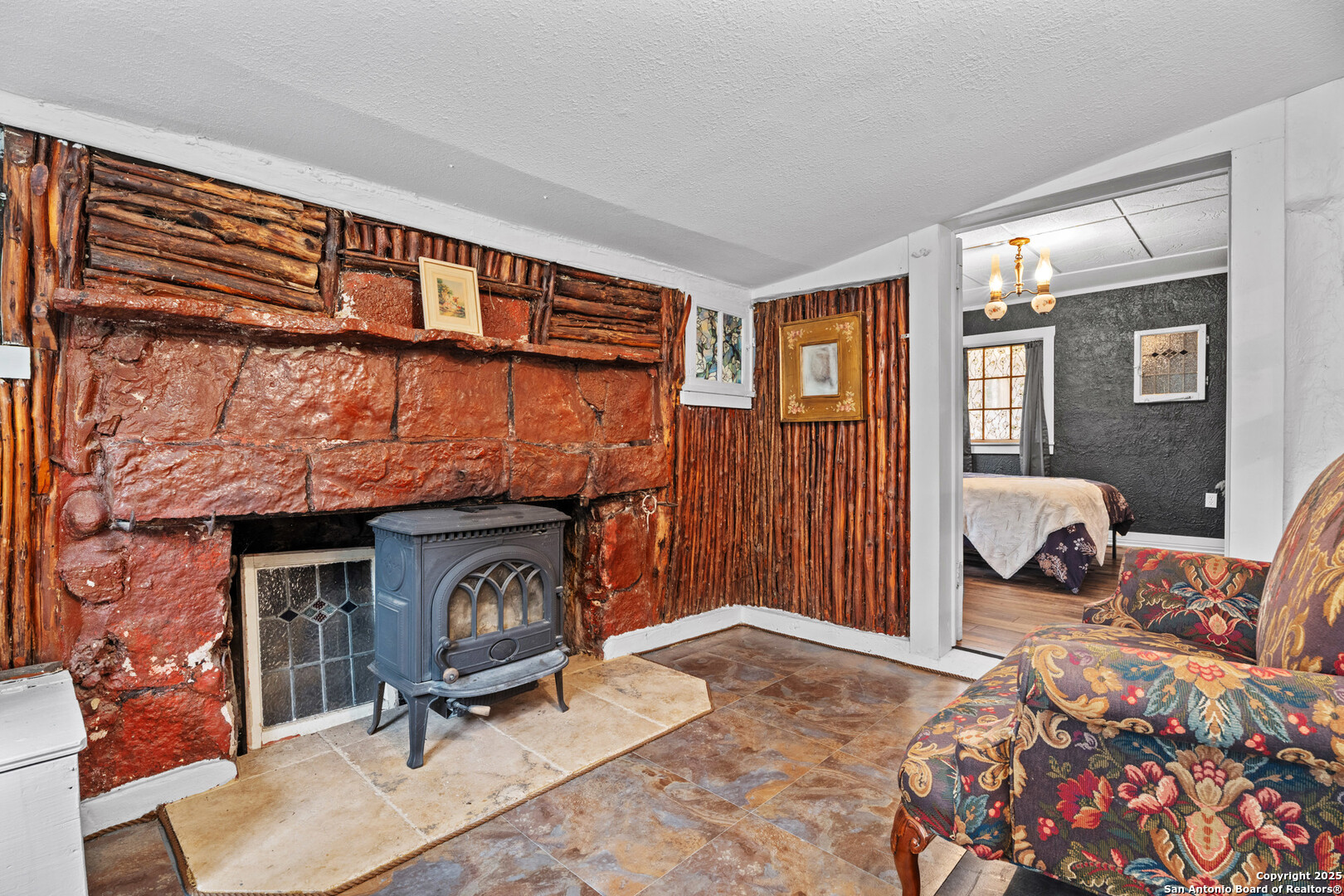 24159 Boerne Stage Road San Antonio, TX 78255 - Photo 74 of 100 a living room with furniture a window and a fireplace